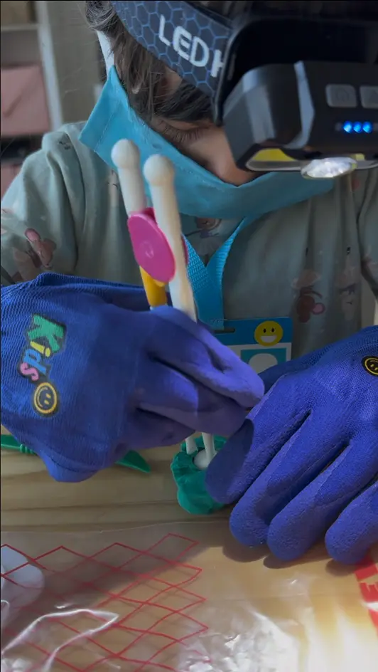 Green play-dough gallbladder cut open to show bead 'gallstones' inside