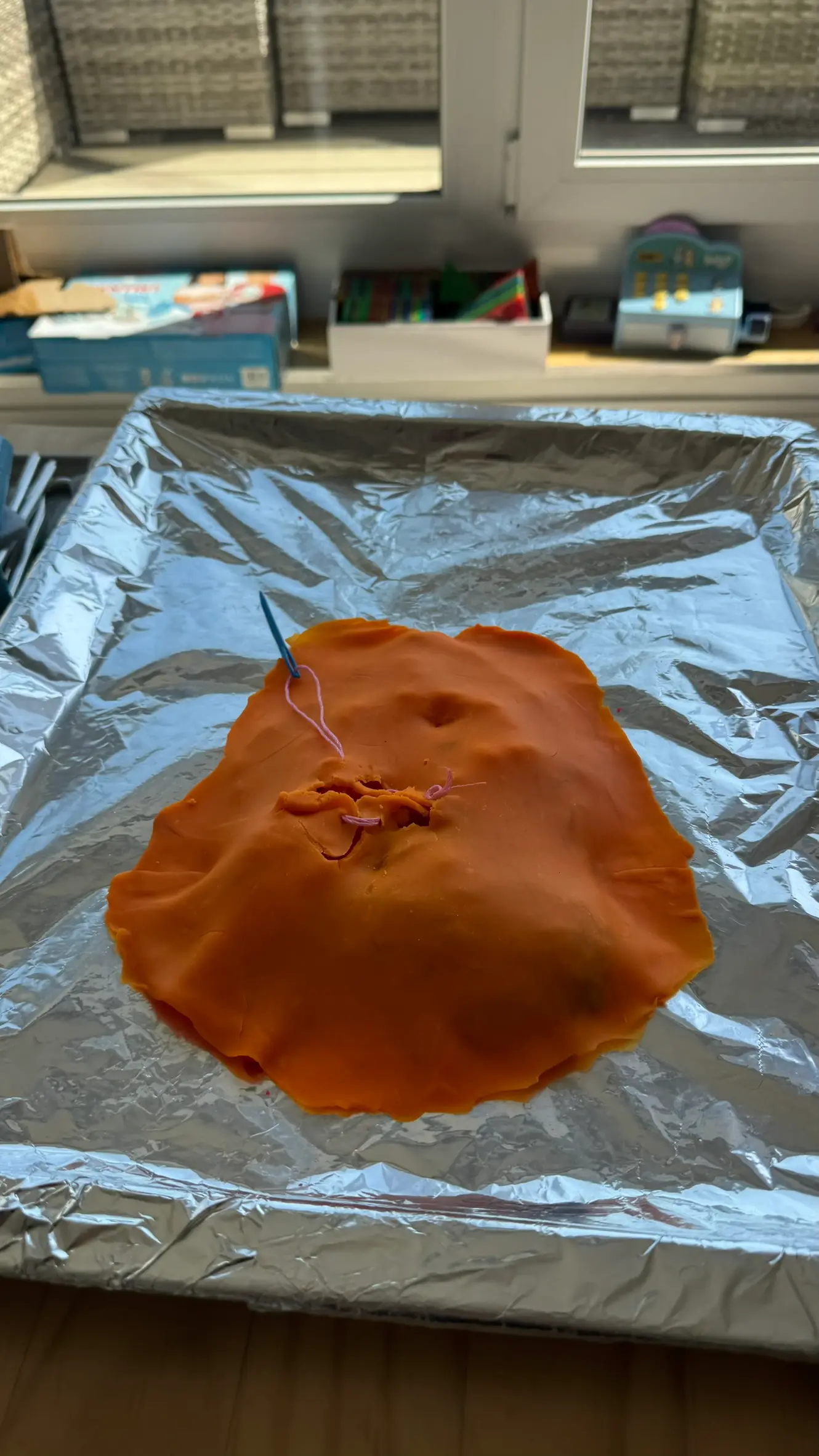Play-dough stomach and skin closed after surgery